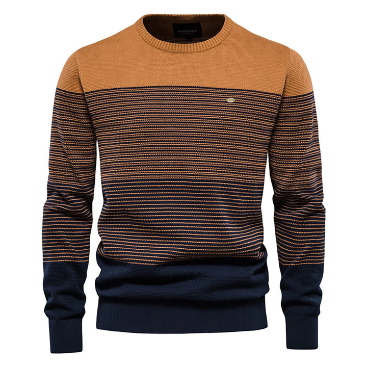 Two-tone sweater with brown and navy design on a white background