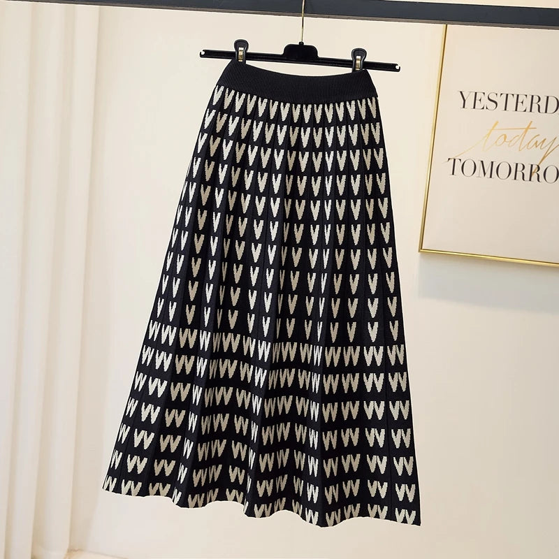 Black and white patterned skirt on a hanger against a light background