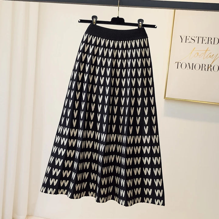 Black and white patterned skirt on a hanger against a light background