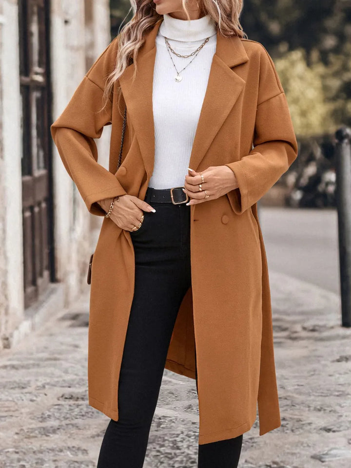 A woman wearing a caramel coat 