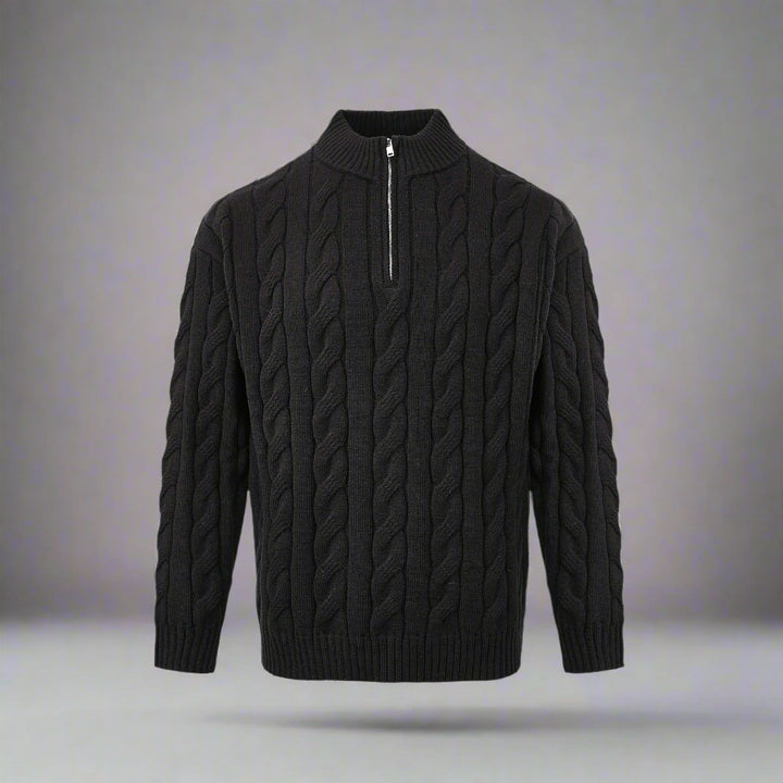 Black cable knit sweater with a quarter zip on a white background
