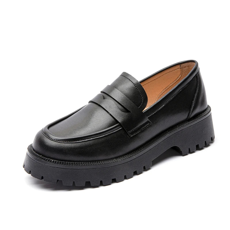 Black leather loafer shoe on a white background