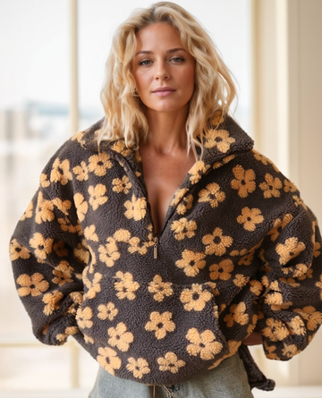 Woman wearing a floral patterned jacket indoors
