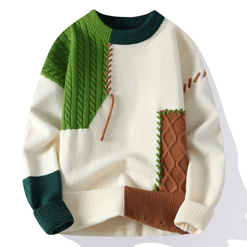 Colorful sweater with green, brown, and white pattern on a white background