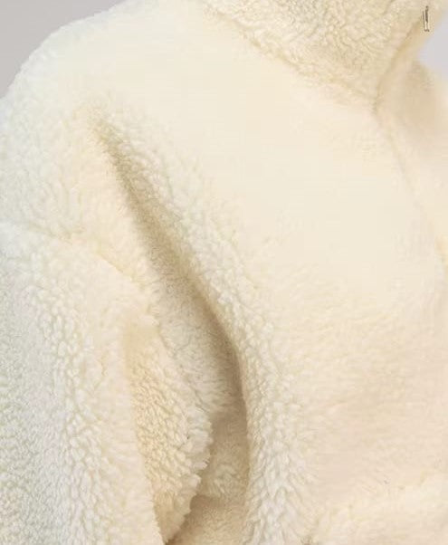 Close-up of a textured cream-colored fabric