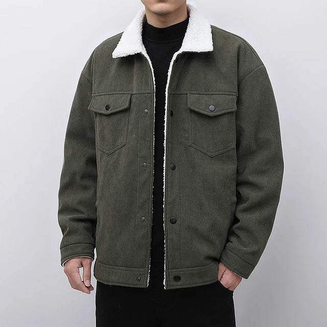 Green corduroy jacket with white sherpa lining on a plain background