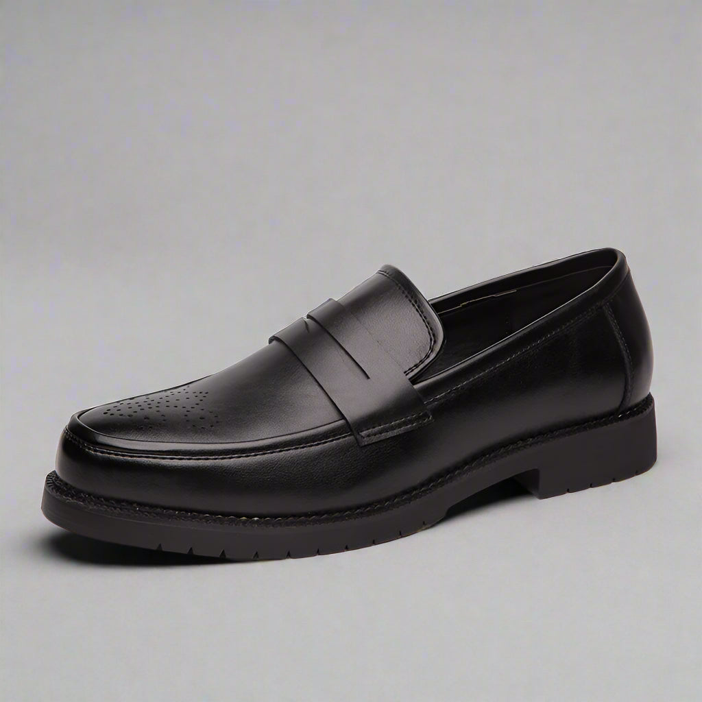 Black leather loafer shoe on a white background
