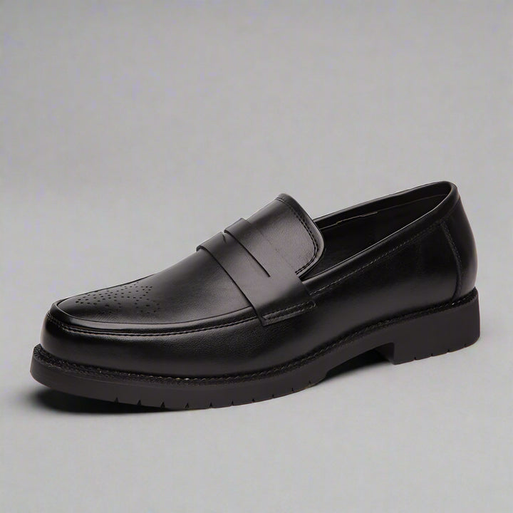 Black leather loafer shoe on a white background