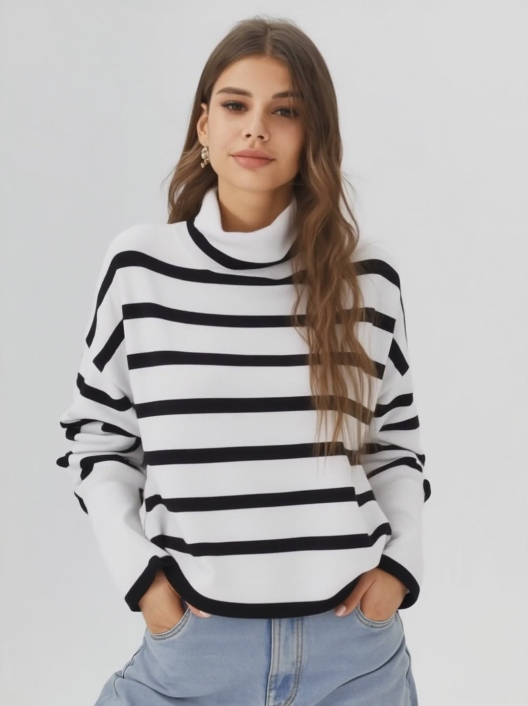 a woman wearing a stripped white turtle neck sweater 