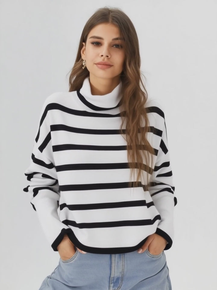 a woman wearing a stripped white turtle neck sweater 